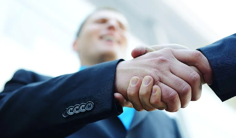 Free and simple photo of men shaking hands from the bottom view 