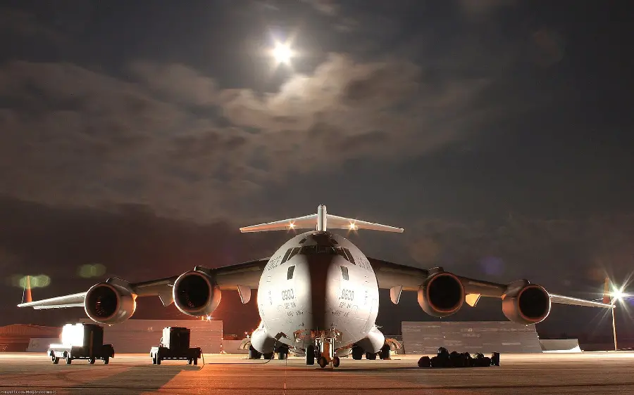 The most beautiful picture of a large cargo plane under the moonlight at night