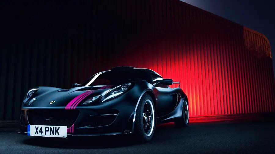 A very beautiful picture of black Lotus car with pink lines