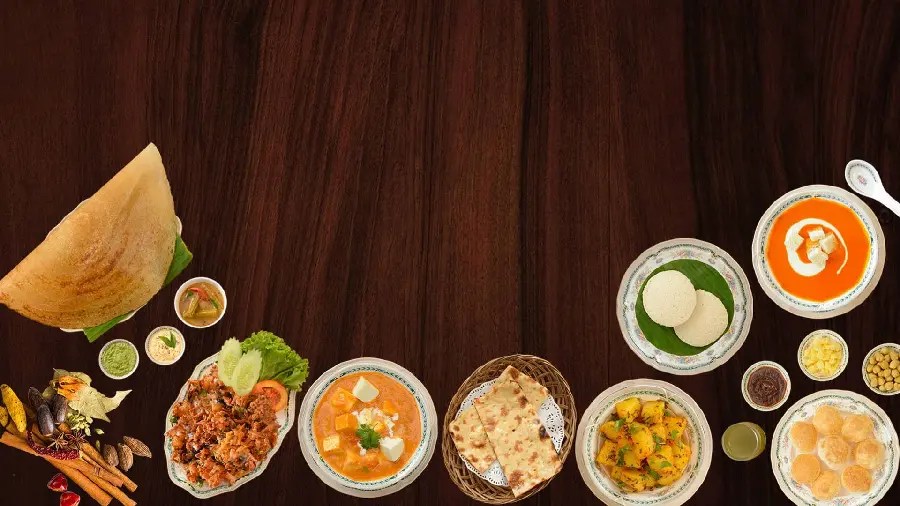 Photo of various tasty restaurant food on a wooden surface for typing