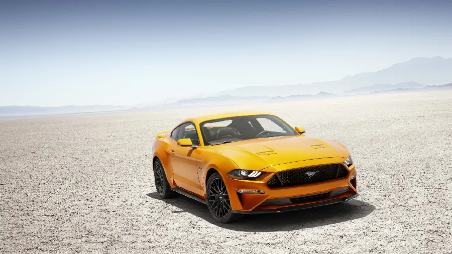 Unique photo of a yellow foreign car in the desert 