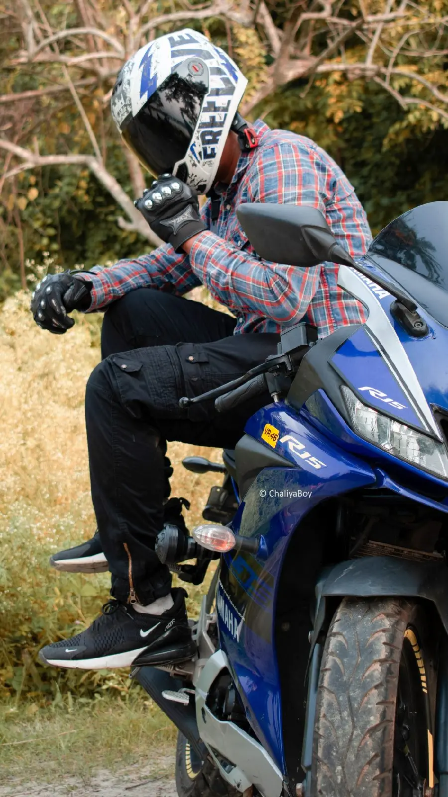 The best fake view without a face of a man sitting on a motorcycle with a helmet 1402