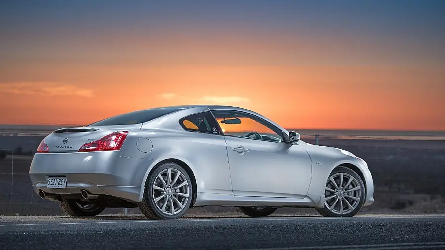 Download stock photo of a white car at sunset