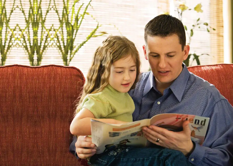 Simple photo of father and daughter reading a book for background and project cover
