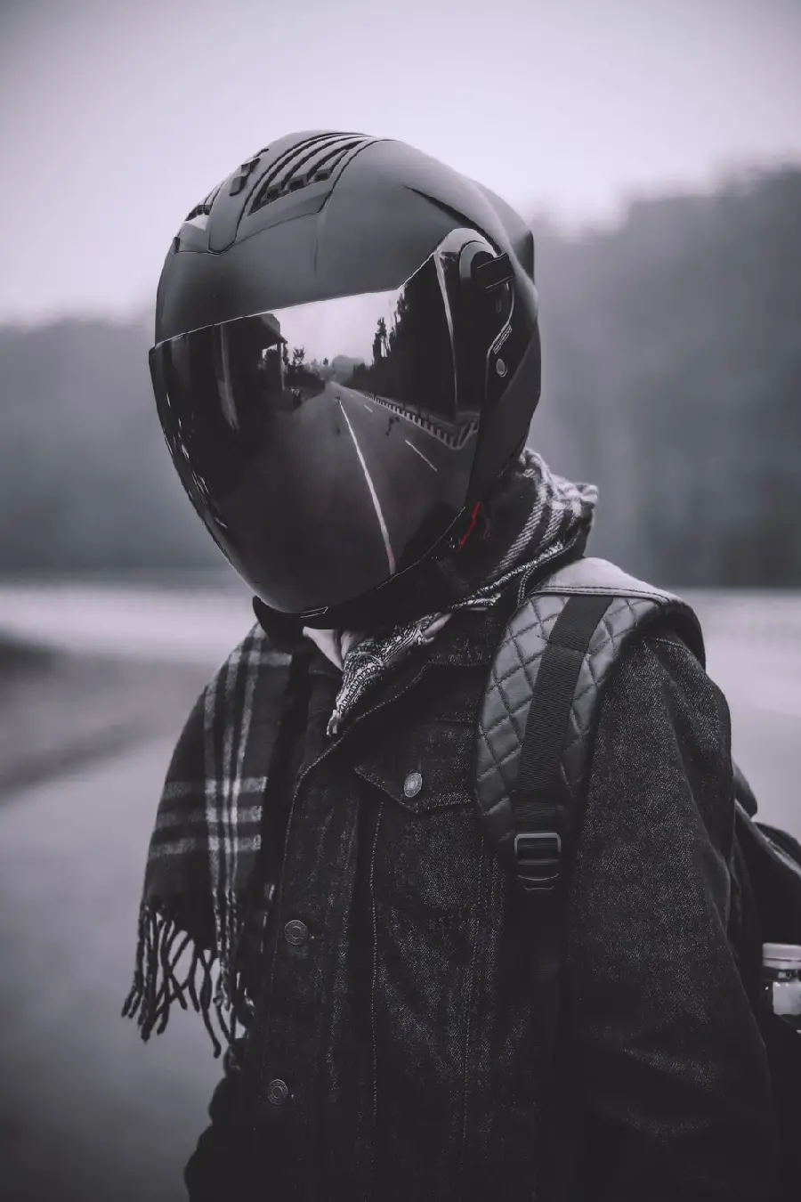 Download Black and White Background of a Man with a Motorcycle Helmet