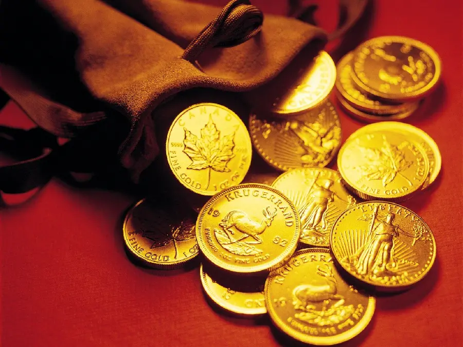 Awesome wallpaper of gold coins spilling out of a bag 