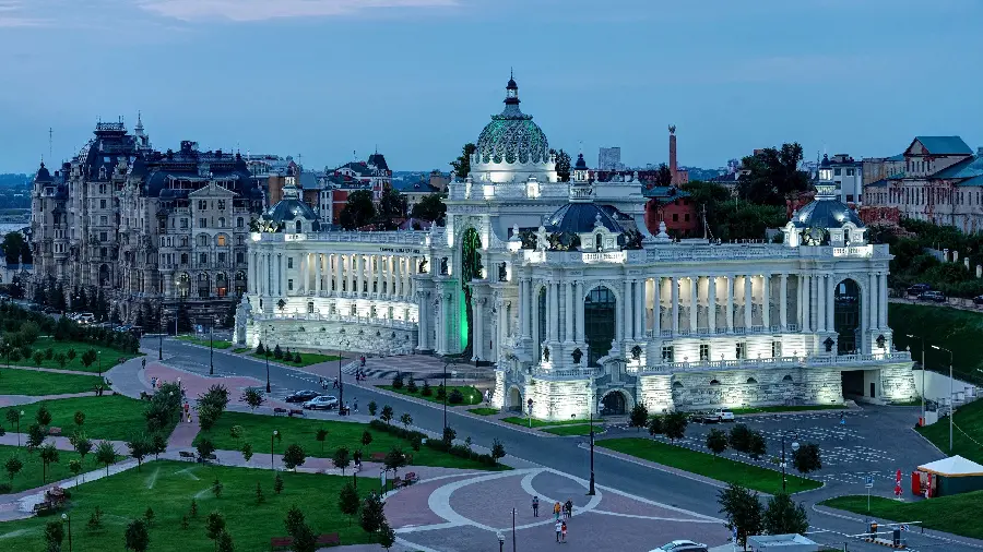 Image of a magnificent white building of a church with blue domes