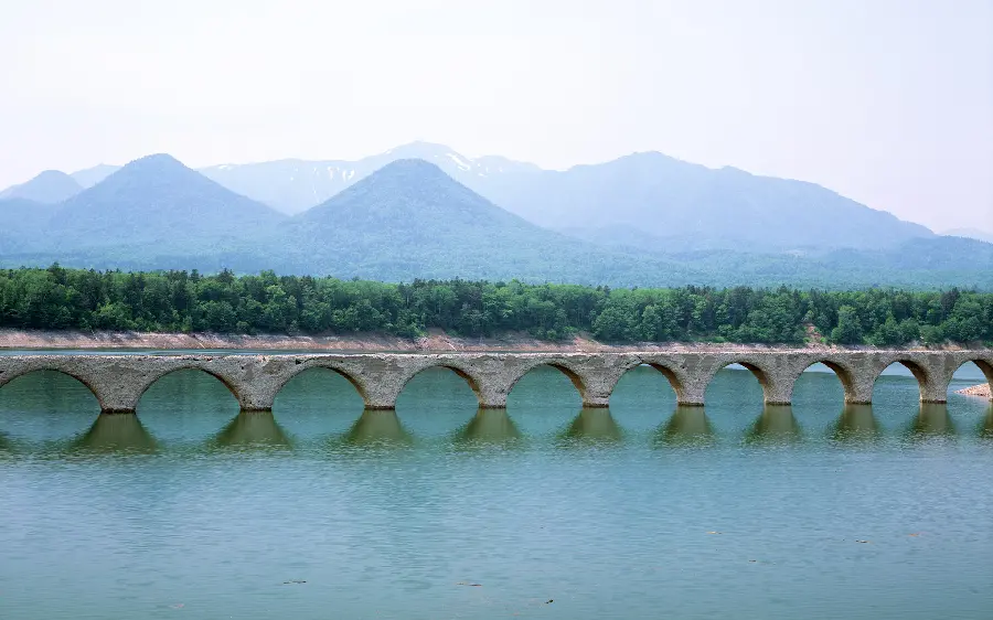 The most commonly used simple photo of an old bridge and water for stories 