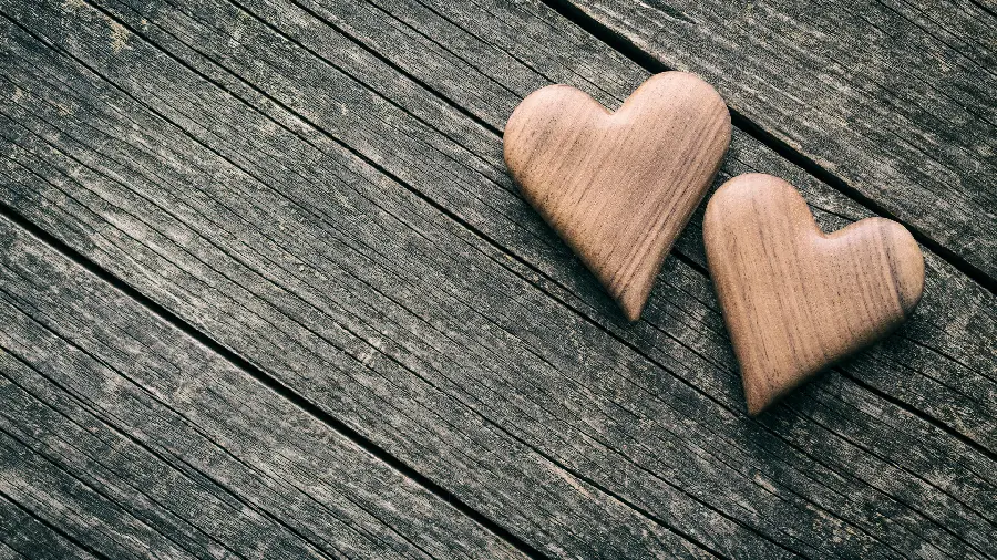 Download a romantic profile picture of two small and delicate wooden hearts