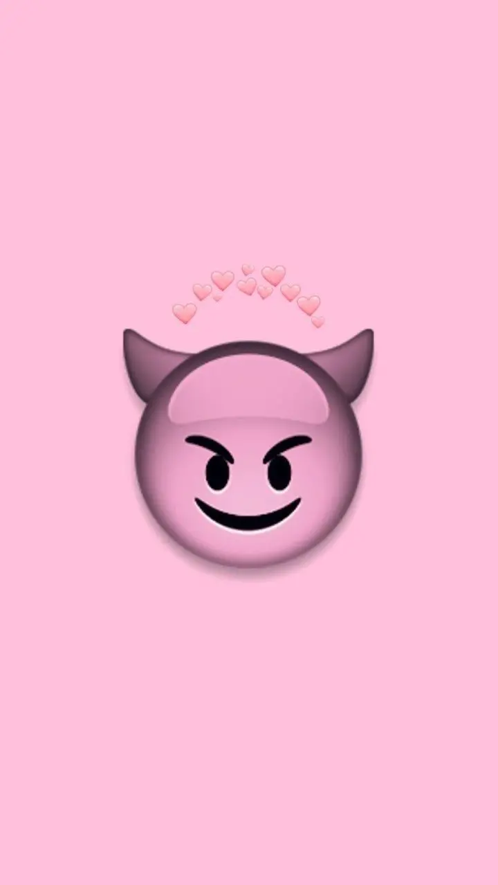  Photo of a mischievous pinkish-purple emoji with a pink heart 