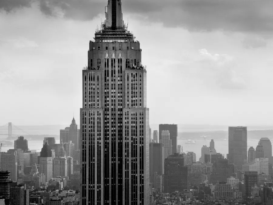 Download a very beautiful and interesting photo of a tall building with dim lights