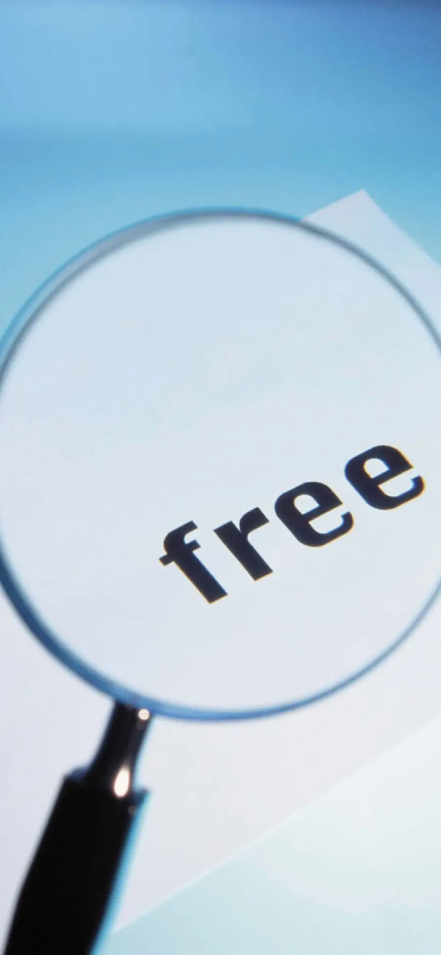  Beautiful image of a magnifying glass on the English word free 