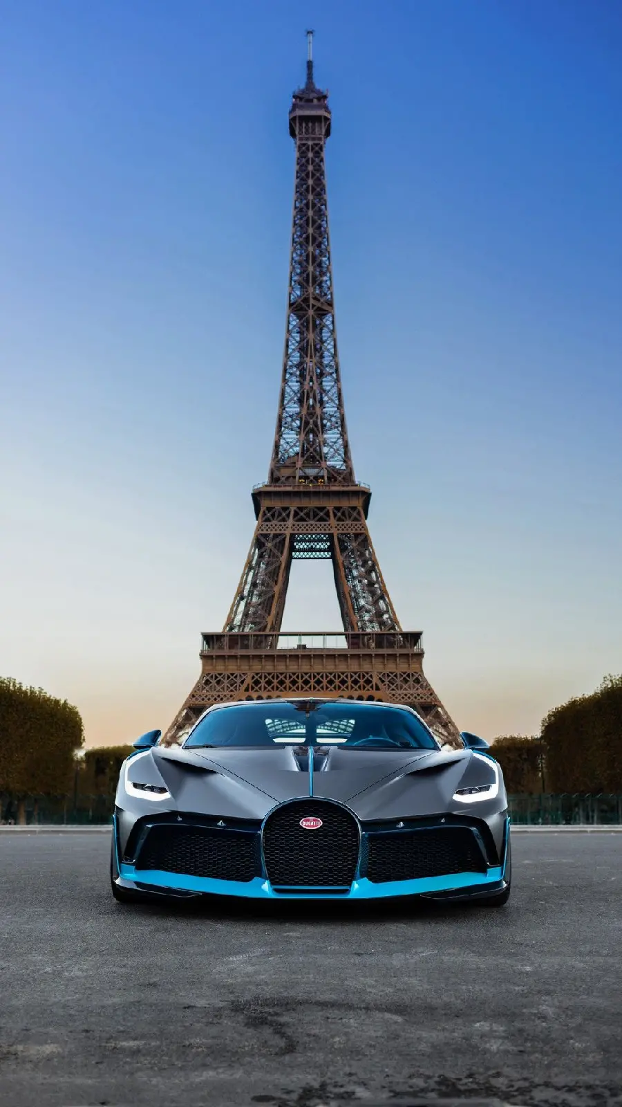 Photo of an expensive Bugatti car under the Eiffel Tower suitable for phone background