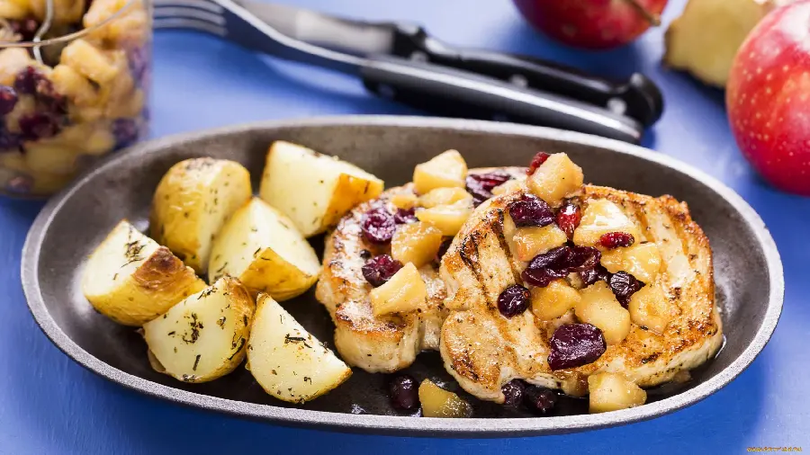 A delightful picture of grilled chicken and baked potatoes 