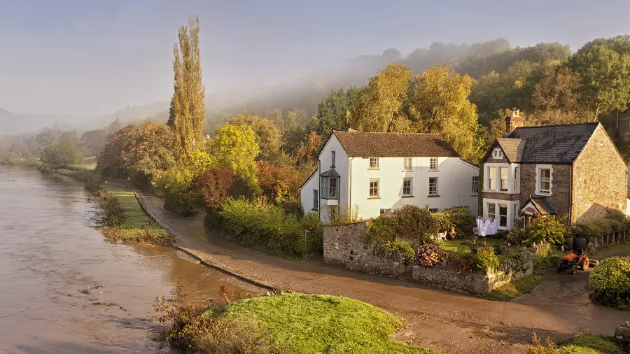 Background photo of huts in the nature of the thousand colors of autumn