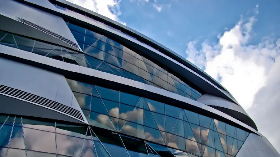 Stock photo of a glass building with a metal layer coating (including a silver layer) of metal compounds 