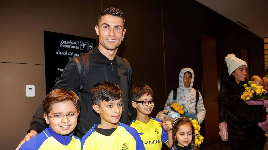 Family group photo of Ronaldo, the best player of Al-Nasr team, with his children 