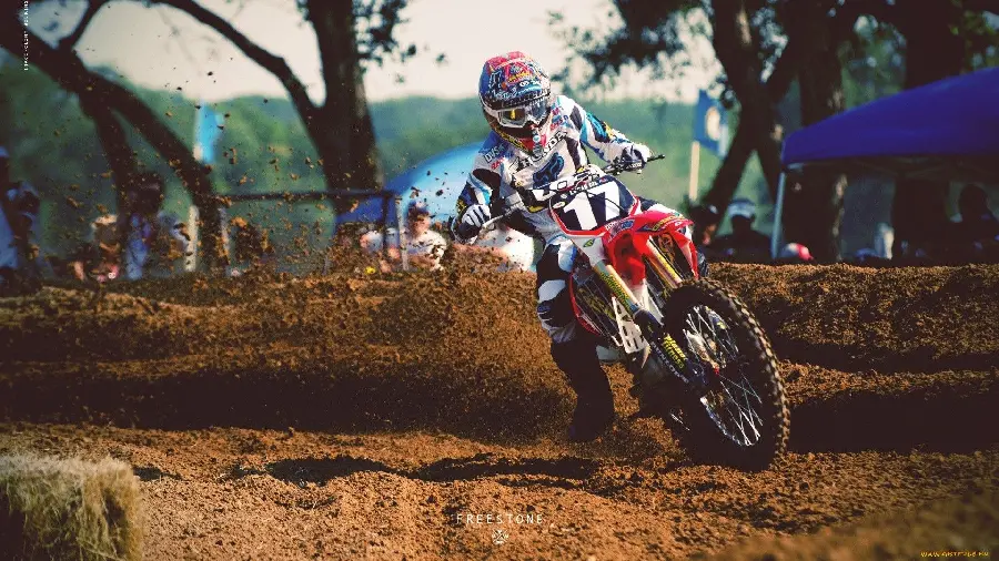 Wallpaper of motocrossers passing on the motorcycle track
