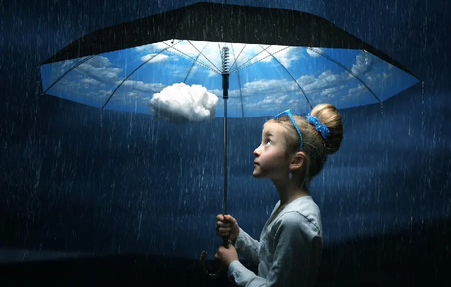 Cute picture of a little girl with an umbrella in the rain with a cool photoshop