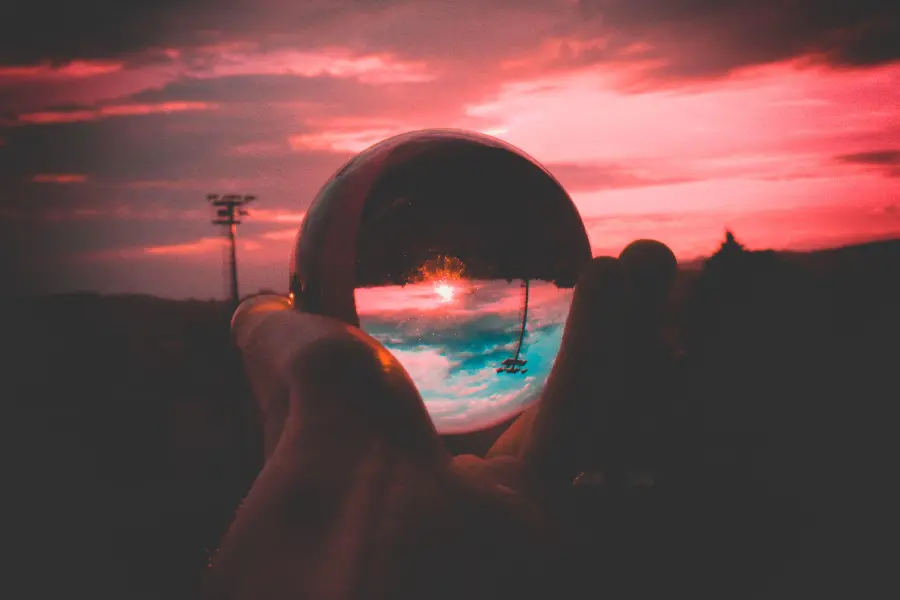Clear and clear glass crystal ball image with a sunset background 