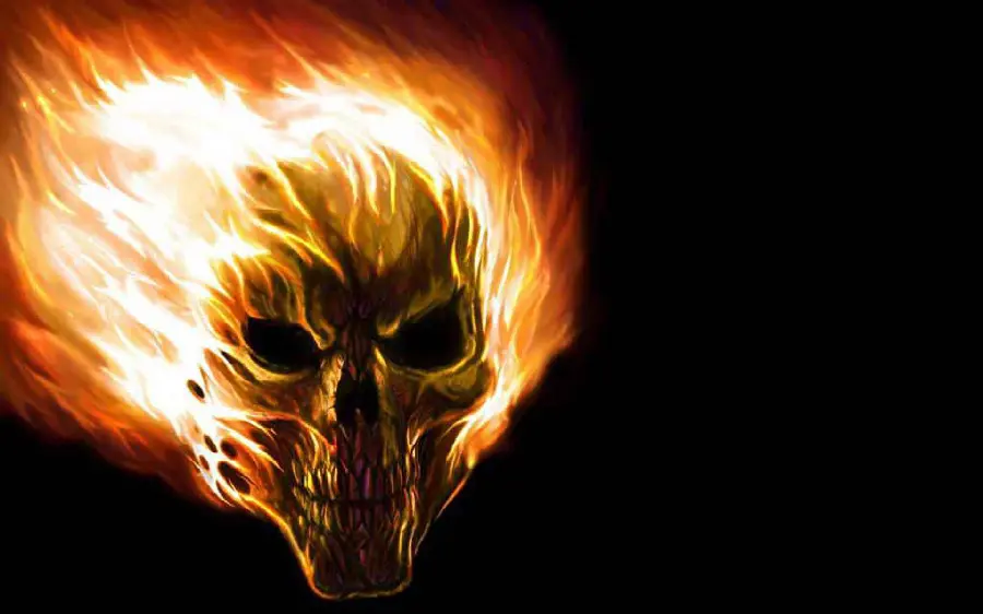 Scary and dark image of a human skull on fire 