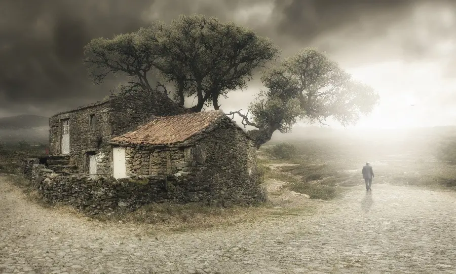 Picture of a beautiful tree house in the middle of the desert with a scary weather 