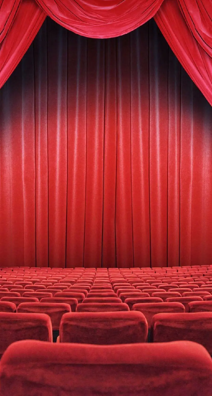 Image of the main view of the theater hall with a vibrant red theme