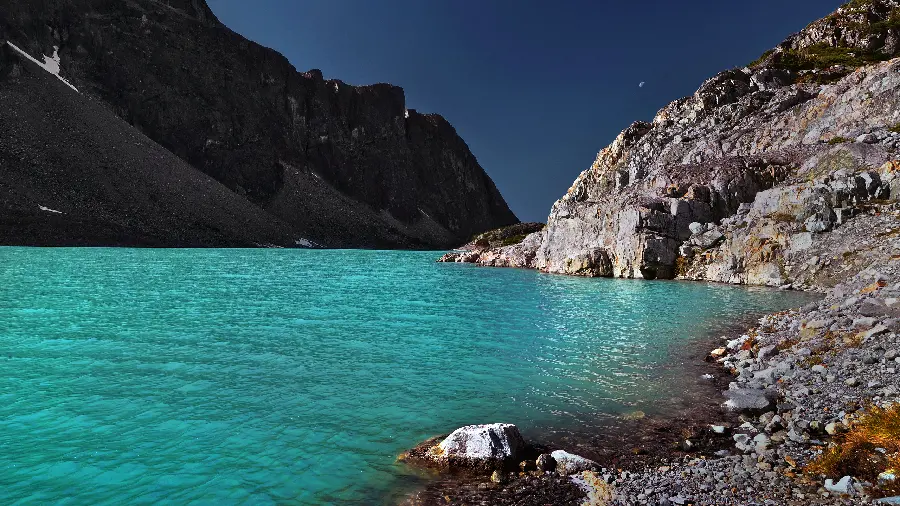 Best Photo of a long rocky beach with a strange green sea 
