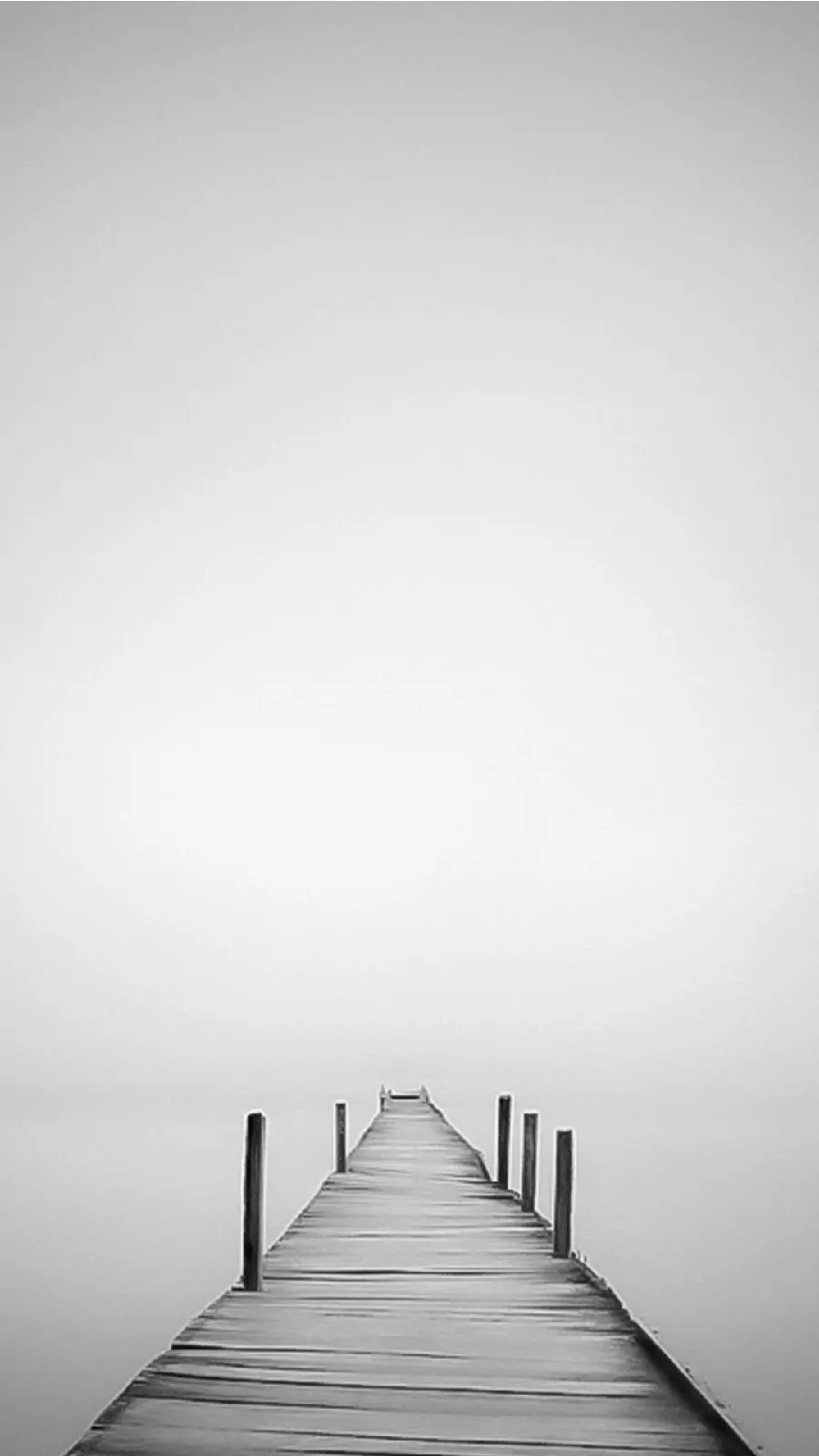 Download simple and conceptual background photo of a wooden bridge on the water, a symbol of silence and loneliness