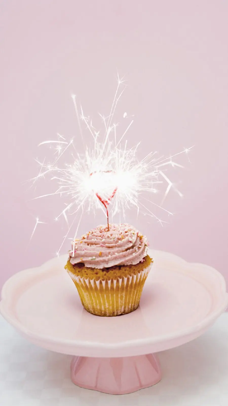 Minimal and modern background image of mini cupcakes with bright fireworks suitable for stories and birthday profiles