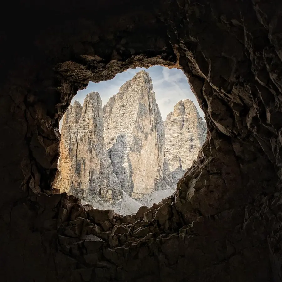 Stock photo of a dark and old cave opening for speleology enthusiasts