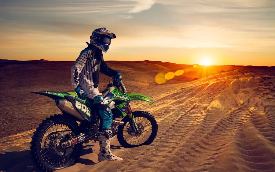 Attractive Highlight Cover Photo of Motorcycle Fun on a Desert Track with a Bright Green Kawasaki KX250