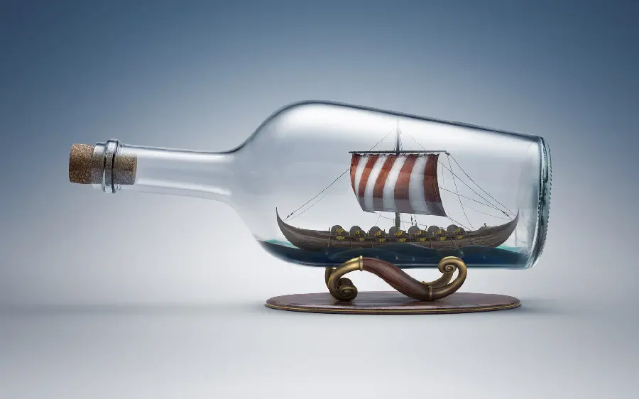 Stylish and luxurious stock photo with a ship design in a glass bottle