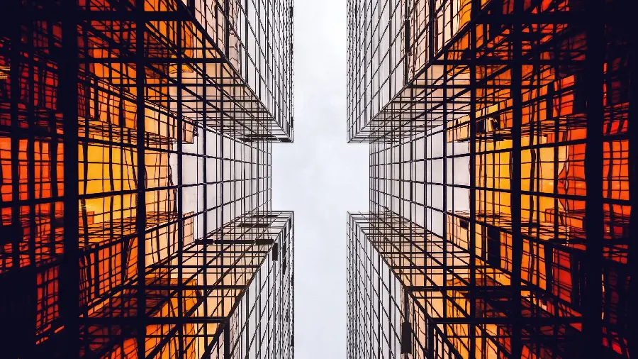 Attractive and beautiful photo of the transparency of the glass walls of modern colored buildings