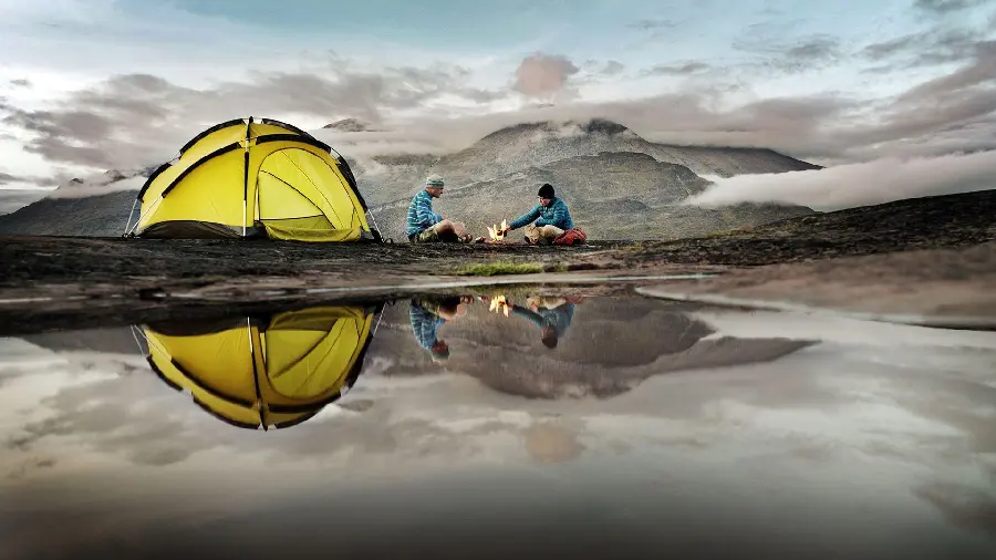 Download the image of a dreamy camp in a tent by the lake