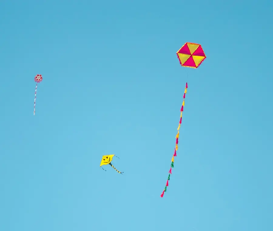 Beautiful image of colorful kites flying in the blue sky