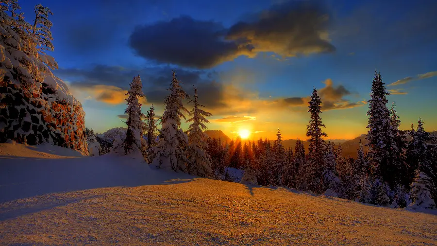 A magical and dreamy wallpaper of a sunset in a snowy and winter landscape