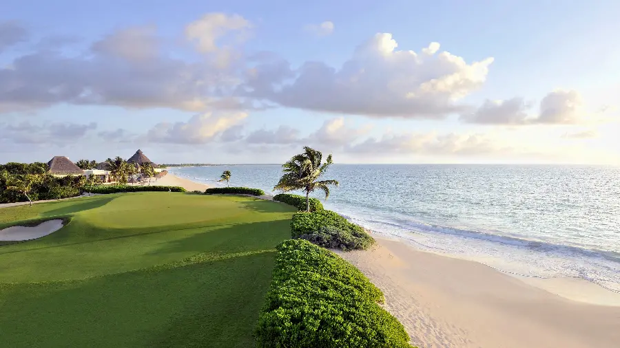 Wallpaper of gently sloping grassy hills by the beach