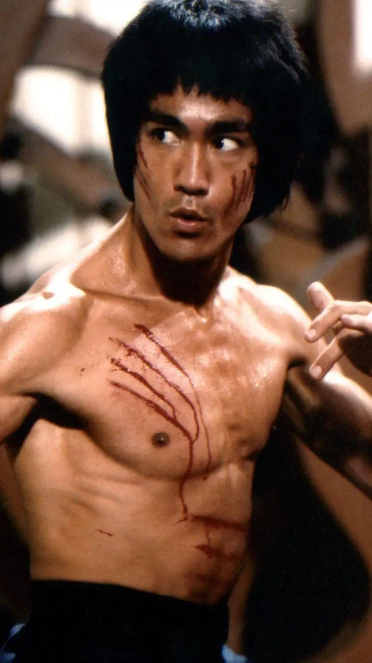 Photo of Bruce Lee while fighting in a movie sequence 