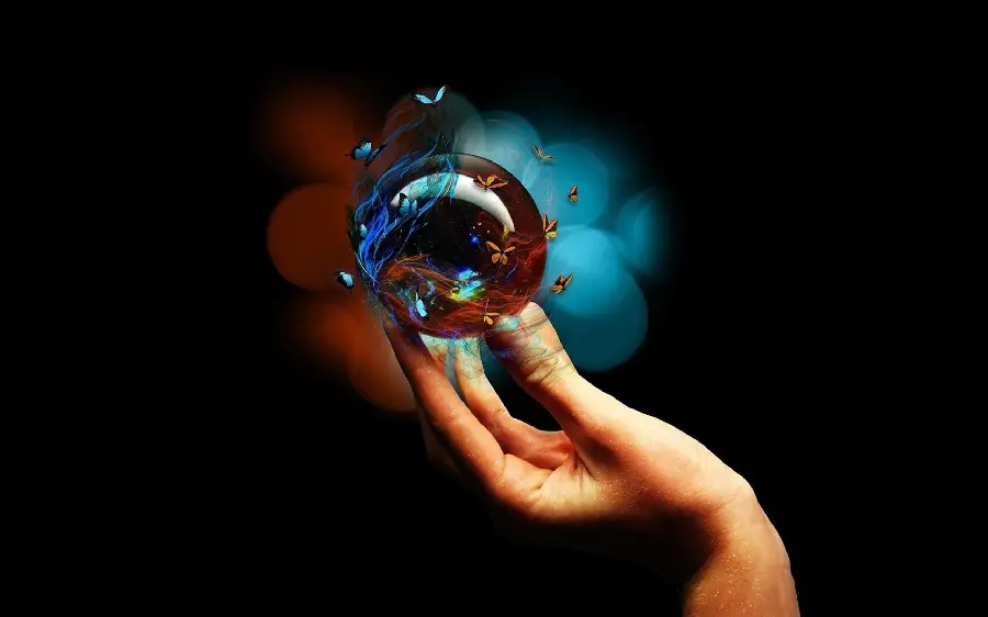 Stock photo of a dreamy crystal ball with a black background suitable for printing decorative boards and posters