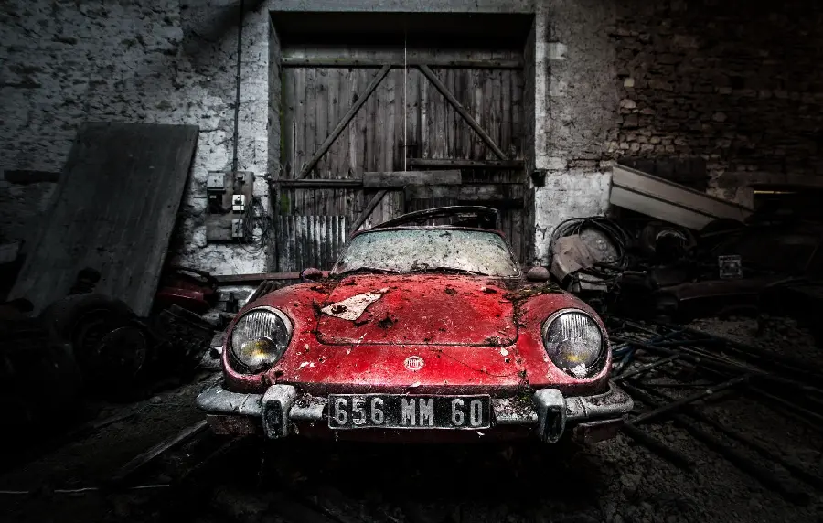 Wallpaper of an old red car on a black and white background