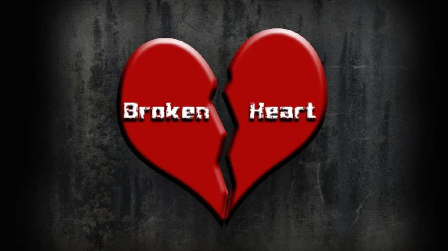 Photo of a sad broken heart with a black background 