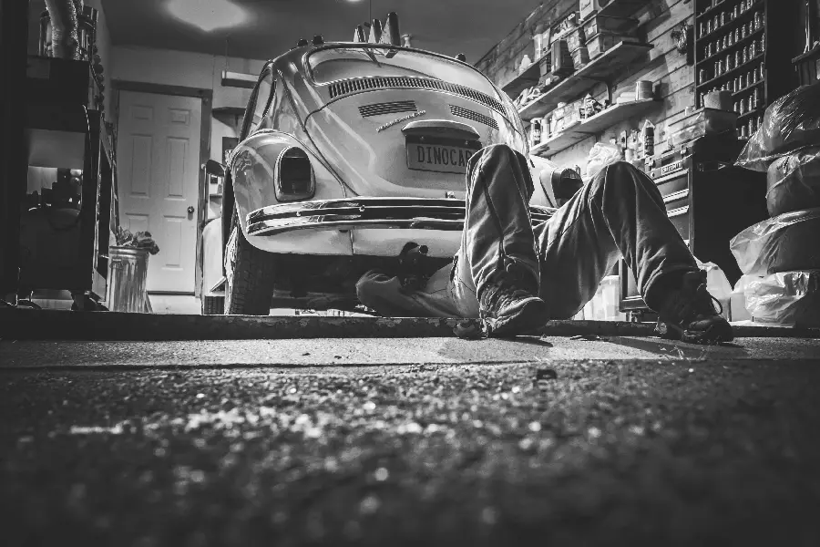 Black and white stock photo of repair tools and vehicle 