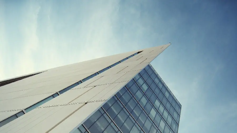 Elegance and brilliance background in the building facade combining stone and glass