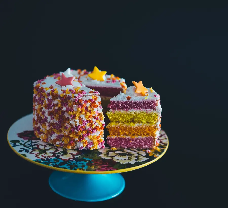 Multicolor Star Cake Wallpaper on Black Background