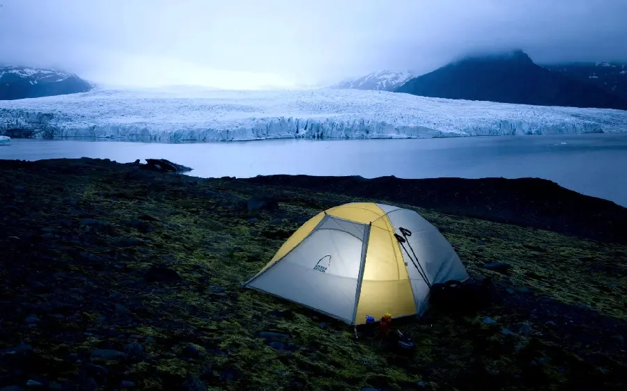Background of a camp inside a tent and a spectacular lake for free download 
