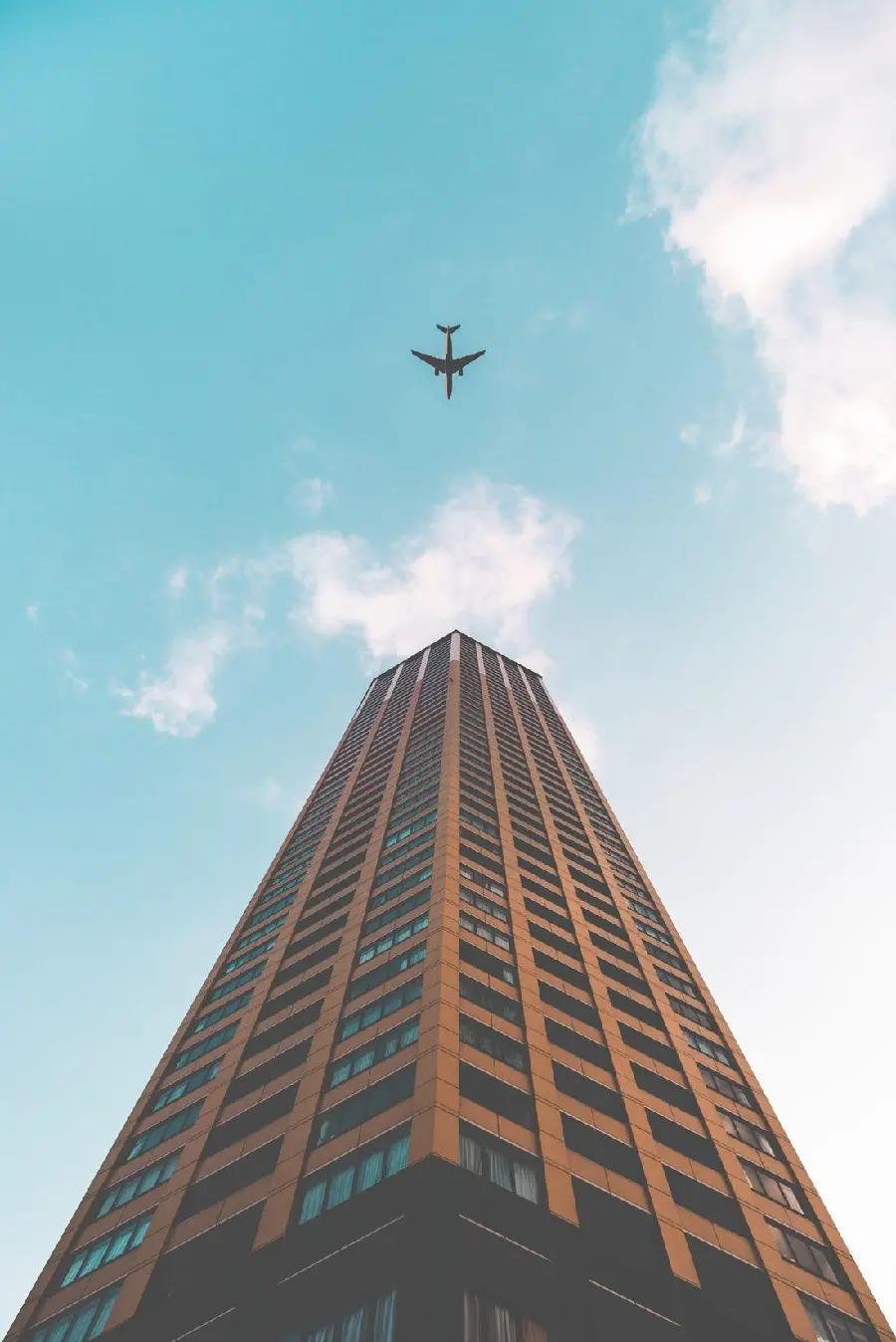 Real architectural design background of a tall building for tasteful architects' laptops and computers