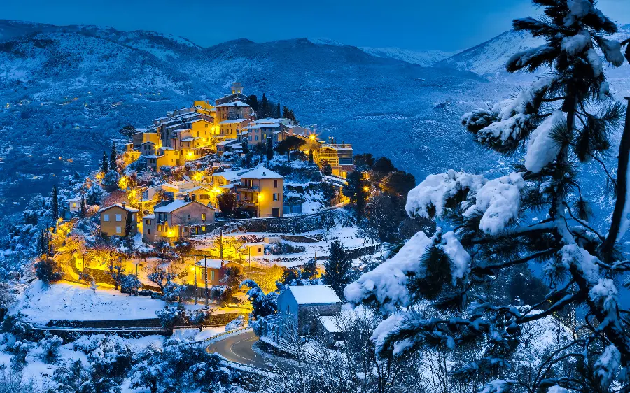 A spectacular winter background photo in a dreamy village among the mountains