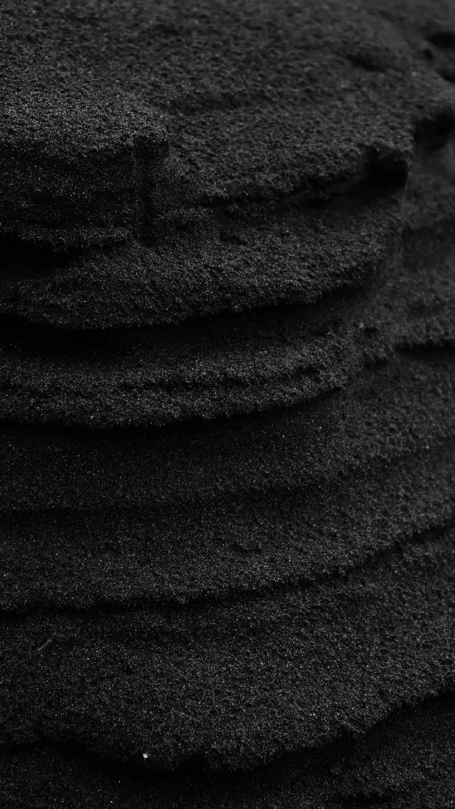 Wallpaper with a unique black sand design