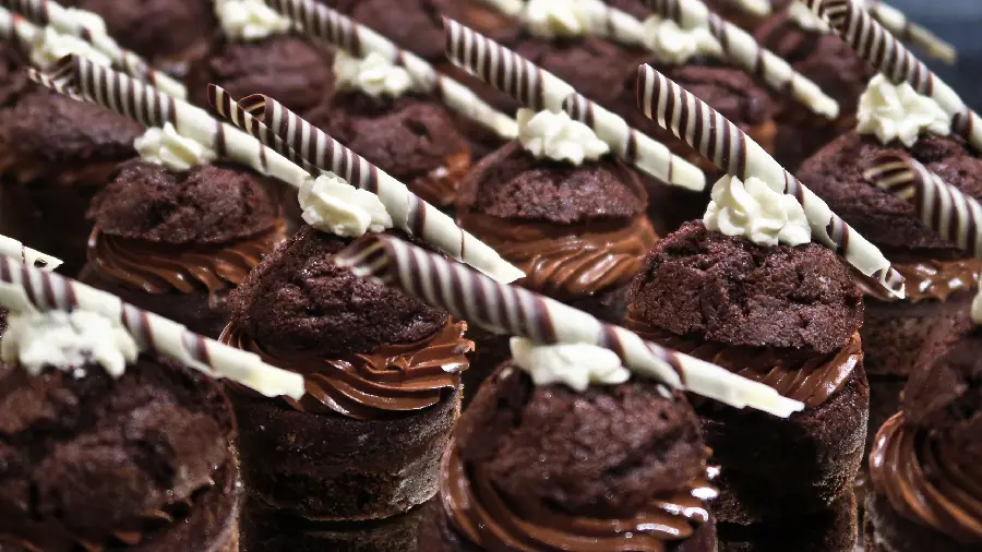 Background of Chocolate Cupcakes Designed with Cream